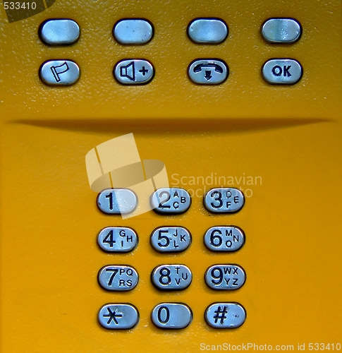 Image of Public phone yellow keypad