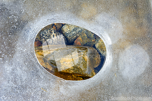 Image of Unique rock formation revealed through a circular opening in the