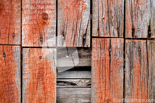 Image of Weathered wooden planks with rusty nails create a rustic backgro