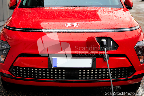 Image of 2024 Red Hyundai Kona II Charging Battery