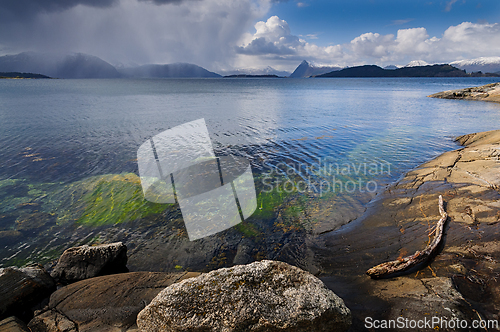 Image of Beautiful coastal landscape with rocky shore and vibrant waters 