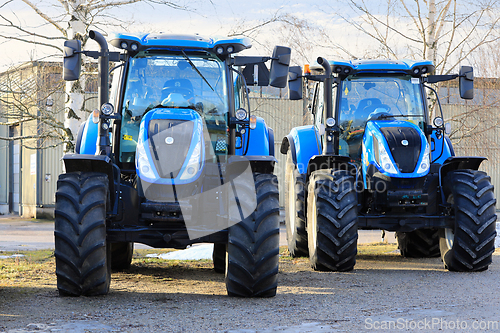 Image of Two New Holland T6 Series All-Purpose Tractors Parked