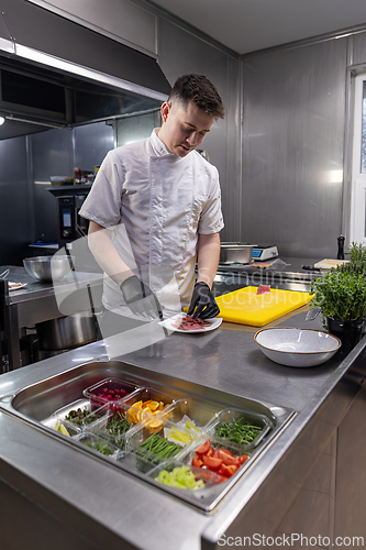 Image of Chef adding smoked salmon