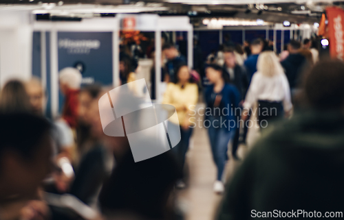 Image of Abstract blurred people at exhibition hall of expo event trade show. Business convention show or job fair. Business concept background.