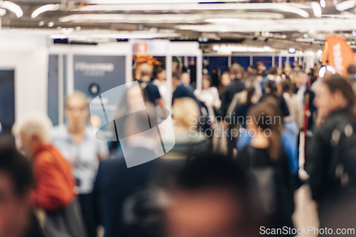 Image of Abstract blurred people at exhibition hall of expo event trade show. Business convention show or job fair. Business concept background.