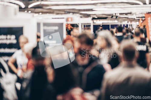 Image of Abstract blurred people at exhibition hall of expo event trade show. Business convention show or job fair. Business concept background.