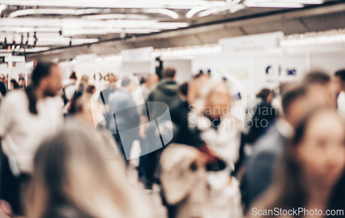 Image of Abstract blurred people at exhibition hall of expo event trade show. Business convention show or job fair. Business concept background.