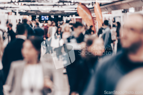 Image of Abstract blurred people at exhibition hall of expo event trade show. Business convention show or job fair. Business concept background.