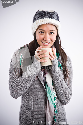 Image of Beautiful asian woman drinking coffee