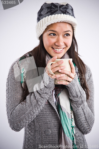 Image of Beautiful asian woman drinking coffee