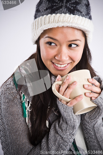 Image of Beautiful asian woman drinking coffee