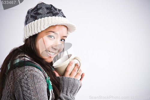 Image of Beautiful asian woman drinking coffee