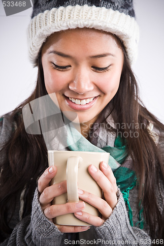 Image of Beautiful asian woman drinking coffee