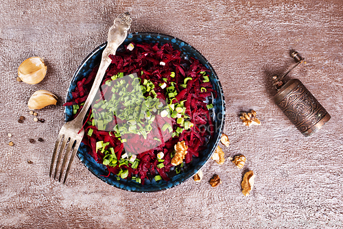 Image of Ripe beet salad with balsamic vinegar dressing and thyme.