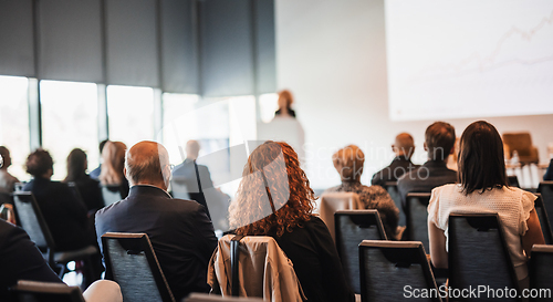 Image of Woman giving presentation on business conference event.