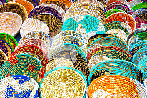Image of Alcudia Mallorca, Collection of handmade woven baskets featuring geometric patterns and beaded details.