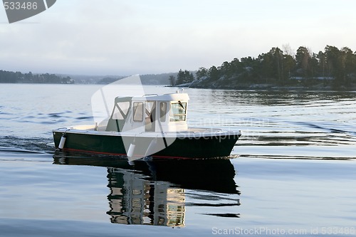 Image of Motorboat on calm water