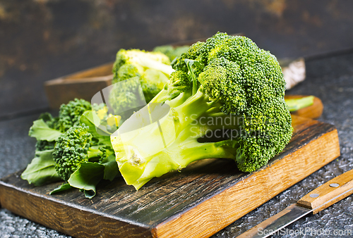 Image of raw broccoli on wooden board, diet food,