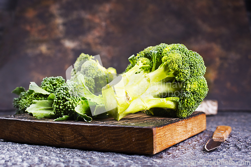 Image of raw broccoli on wooden board, diet food,