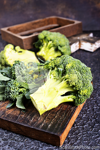 Image of raw broccoli on wooden board, diet food,