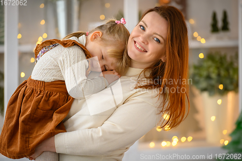 Image of family portrait, happy mother and daughter at Christmas time