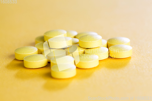 Image of tablets on a yellow background