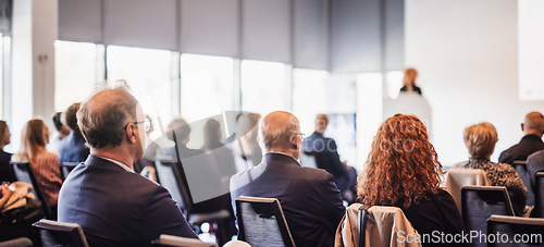 Image of Woman giving presentation on business conference event.
