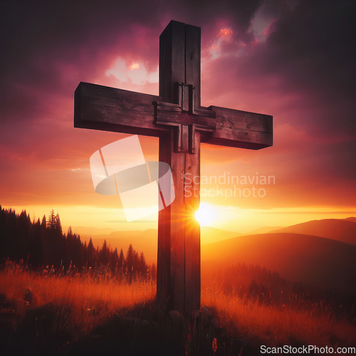 Image of christian cross standing strong and proud before a beautiful sunset 
