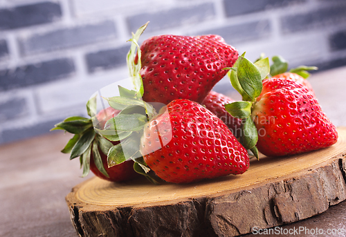 Image of strawberry on wooden board, fresh strowberry