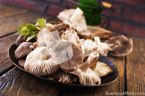 Image of Pile of fresh mushrooms on wooden table