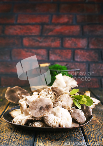 Image of Pile of fresh mushrooms on wooden table
