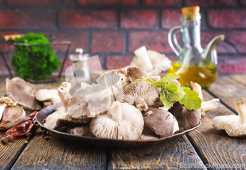 Image of Pile of fresh mushrooms on wooden table