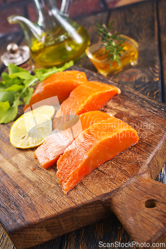 Image of raw salmon with fresh lemon and salt