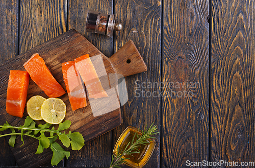 Image of raw salmon with fresh lemon and salt