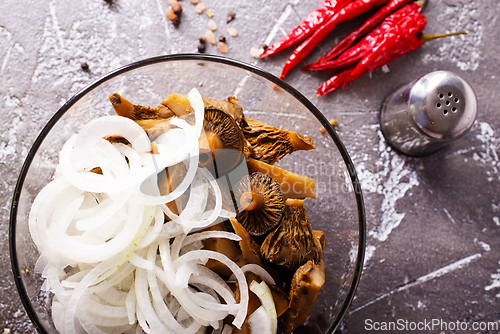 Image of Marinated mushrooms in a glass bowl