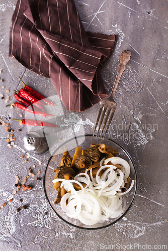 Image of Marinated mushrooms in a glass bowl
