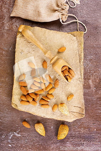 Image of Almond on stone background, dry almond