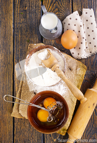 Image of Baking background. Ingredients, kitchen utensils for baking cakes and cookies.