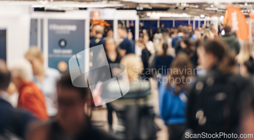 Image of Abstract blurred people at exhibition hall of expo event trade show. Business convention show or job fair. Business concept background.