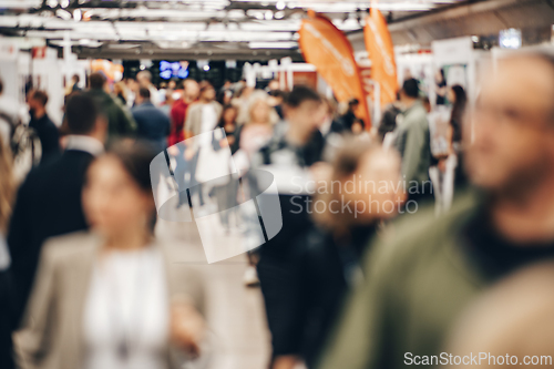 Image of Abstract blurred people at exhibition hall of expo event trade show. Business convention show or job fair. Business concept background.