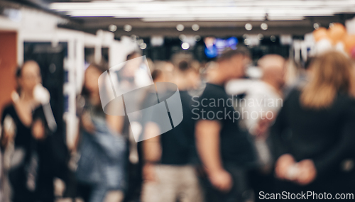 Image of Abstract blurred people at exhibition hall of expo event trade show. Business convention show or job fair. Business concept background.