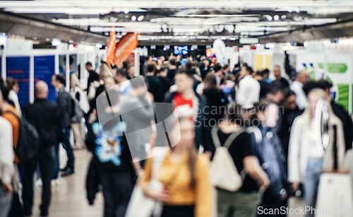 Image of Abstract blurred people at exhibition hall of expo event trade show. Business convention show or job fair. Business concept background.