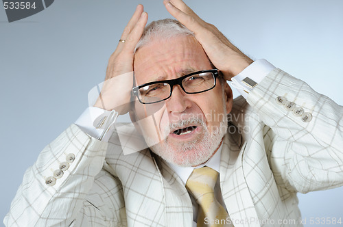 Image of Portrait of unhappy senior businessman