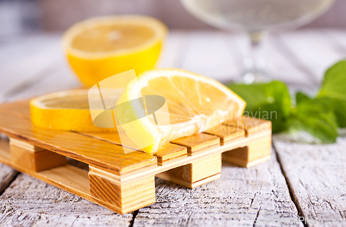 Image of fresh lemon and mint for cocktail on a table