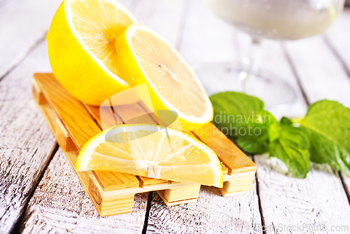 Image of fresh lemon and mint for cocktail on a table
