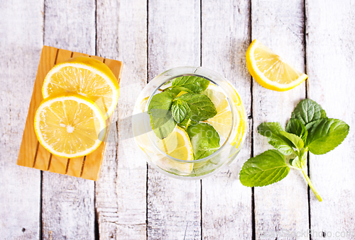 Image of fresh lemon and mint for cocktail on a table