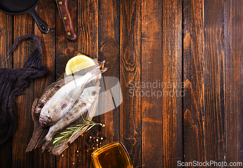 Image of raw fish with salt and spice