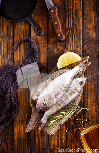 Image of raw fish with salt and spice