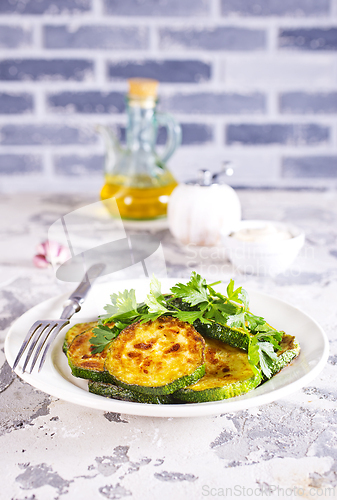 Image of Heap of fried green zucchini with garlic
