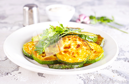 Image of Heap of fried green zucchini with garlic